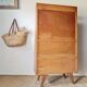 Vintage 1950s wooden secretary with tapered legs and mint interior.