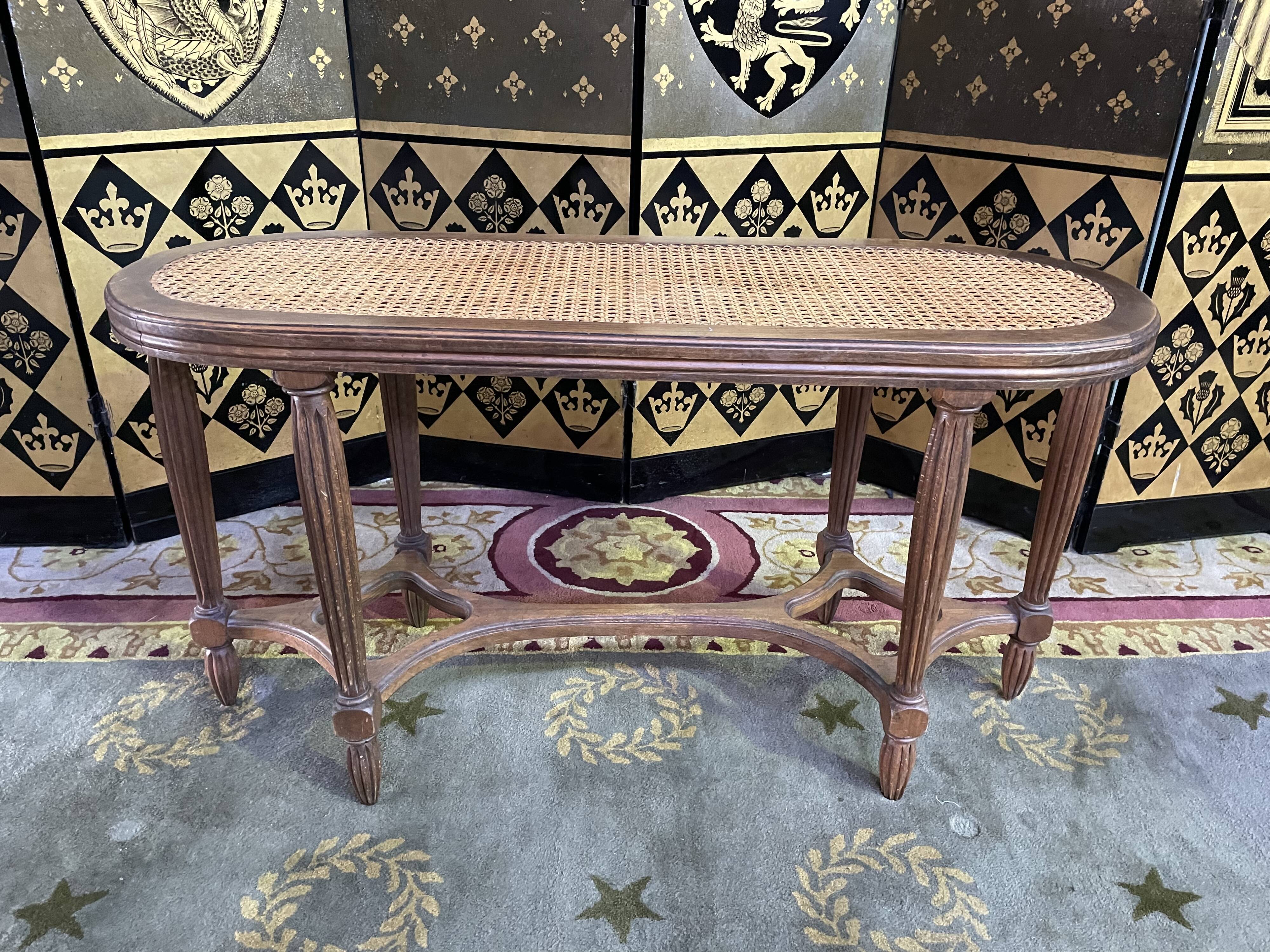 Louis XVI piano bench in cannage