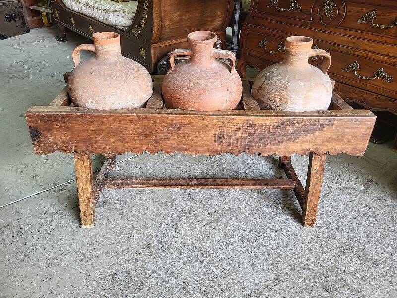 Old wooden jar holder with 3 clay jars