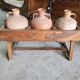 Old wooden jar holder with 3 clay jars