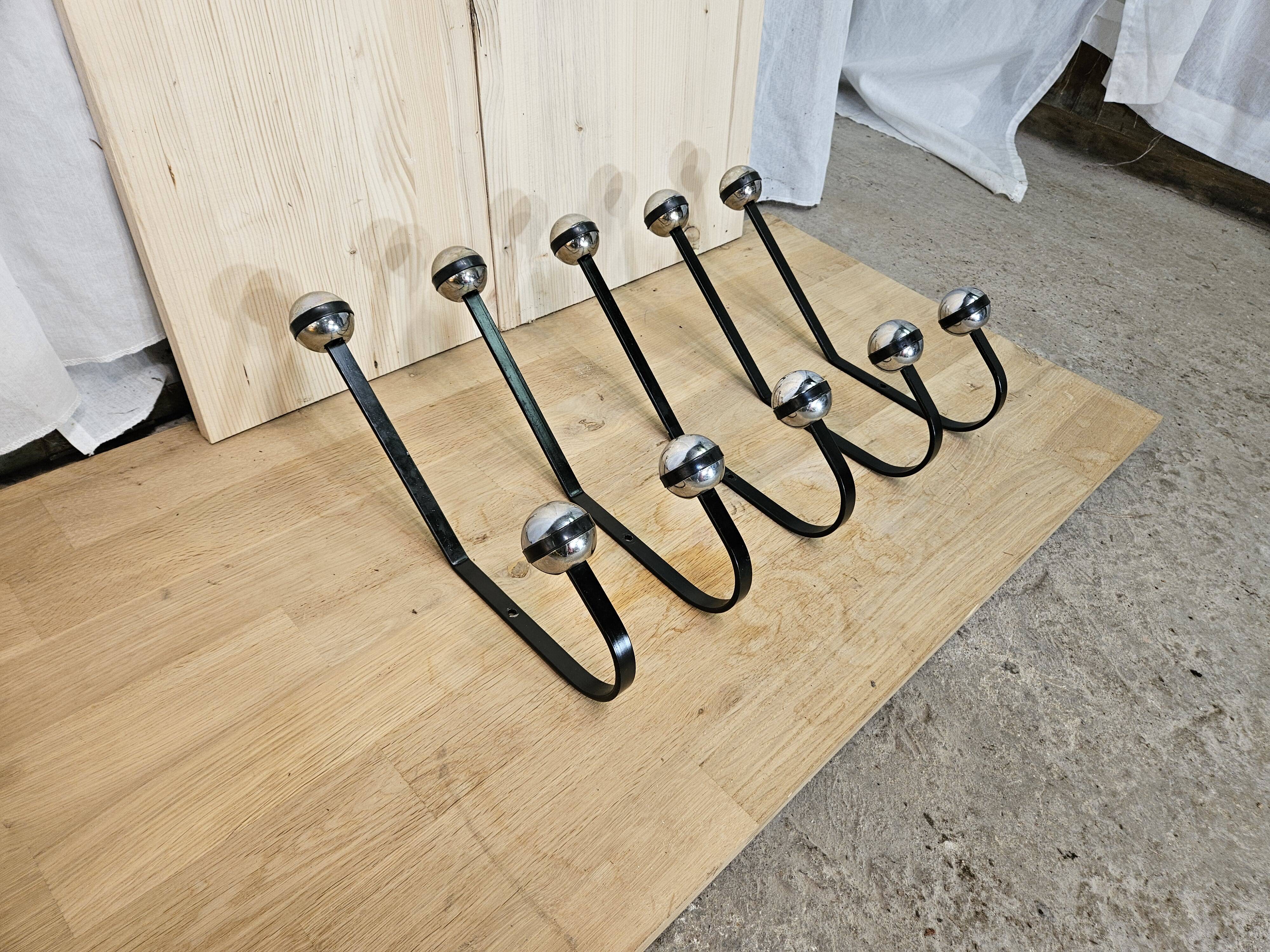 5 black and silver coat hooks from the 60s