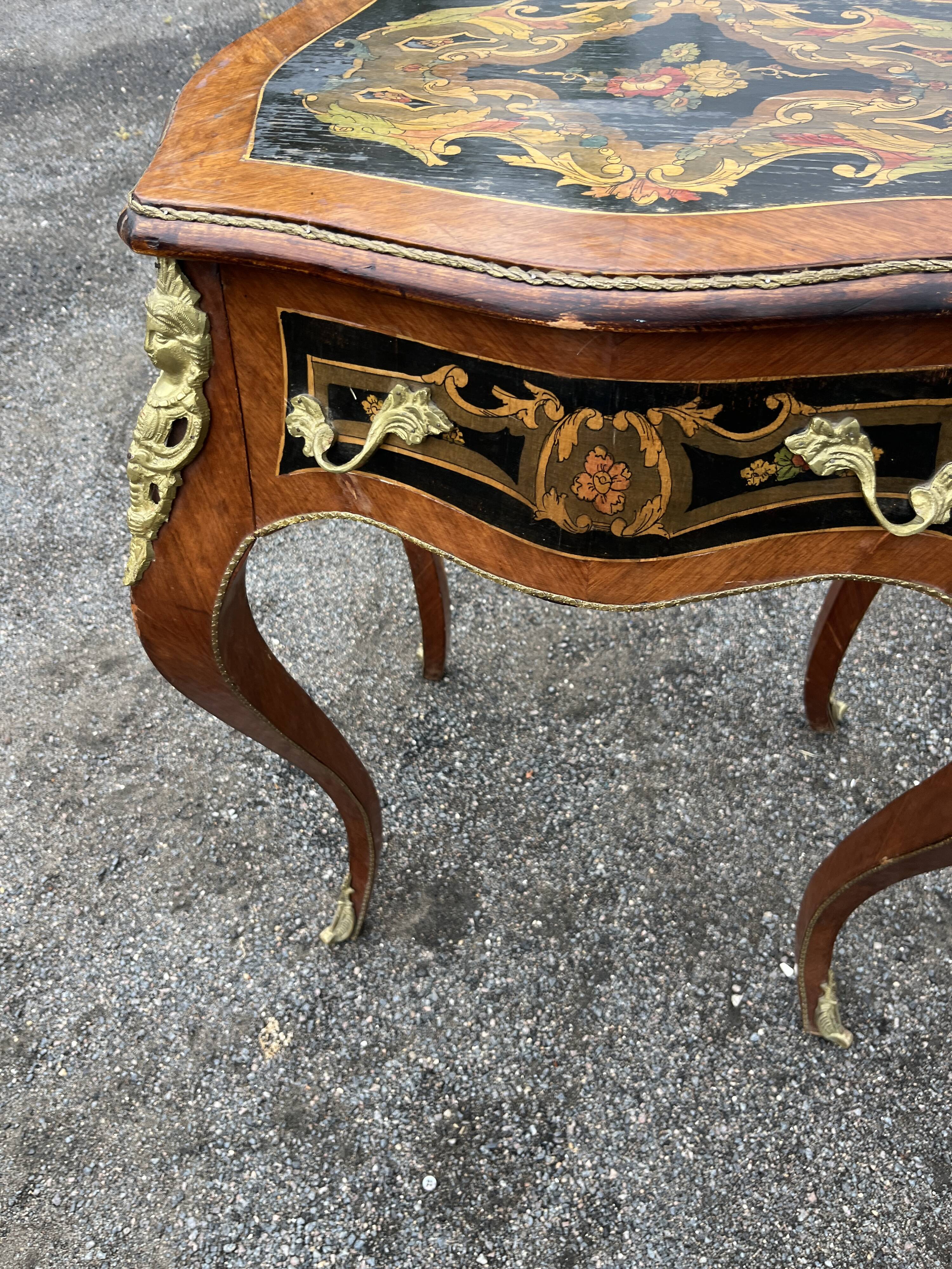 Louis XV style side table with marquetry and gilded bronze.