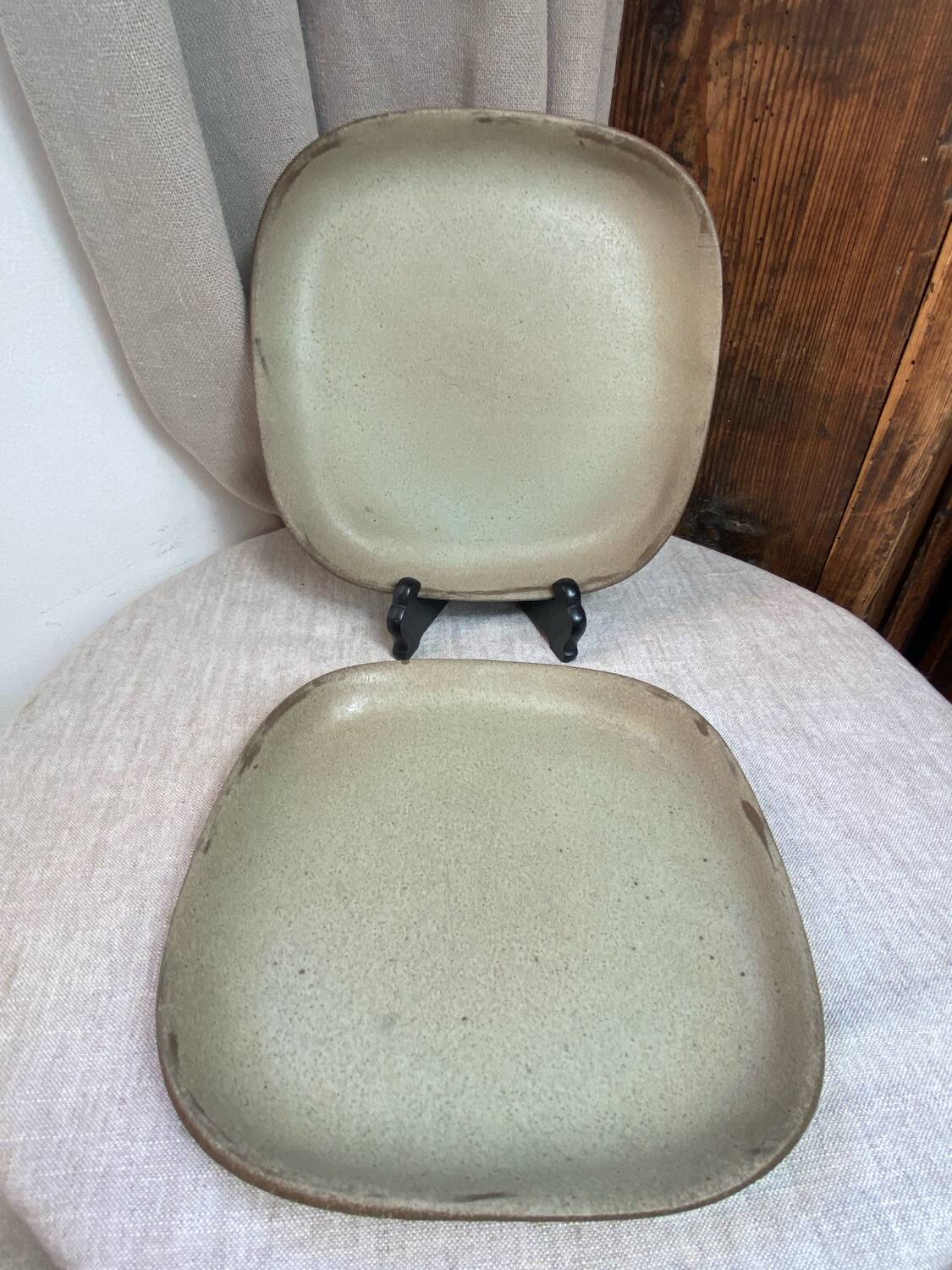 Two gray stoneware plates