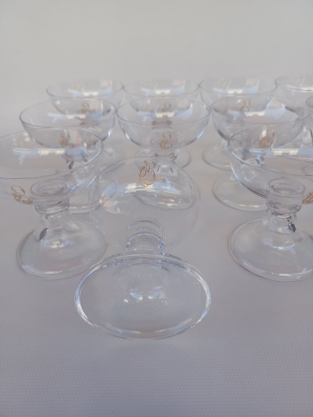 12 Val Saint Lambert crystal champagne glasses. Plain Bell Foot Service. Late 19th century.