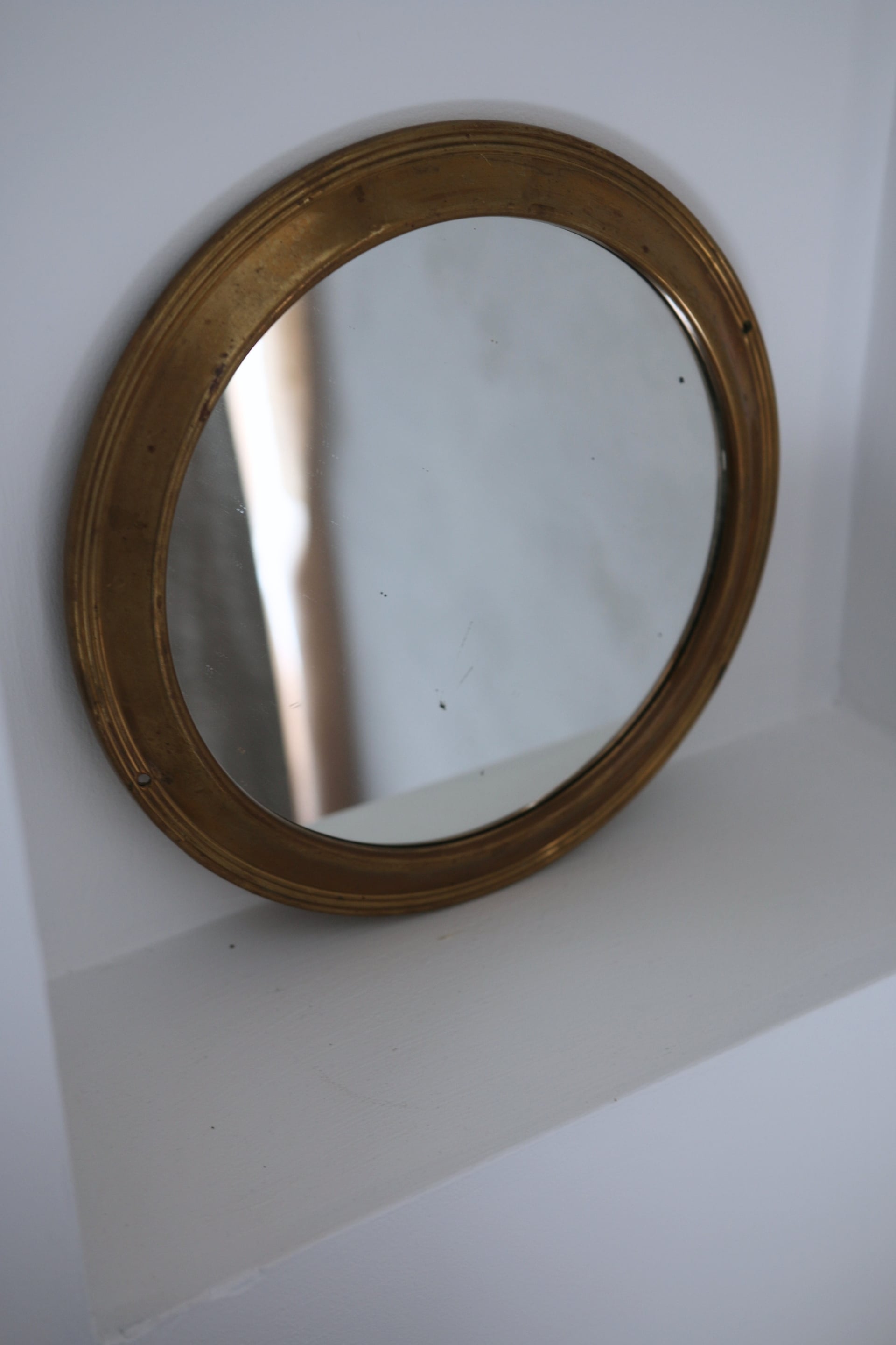 Antique round brass mirror