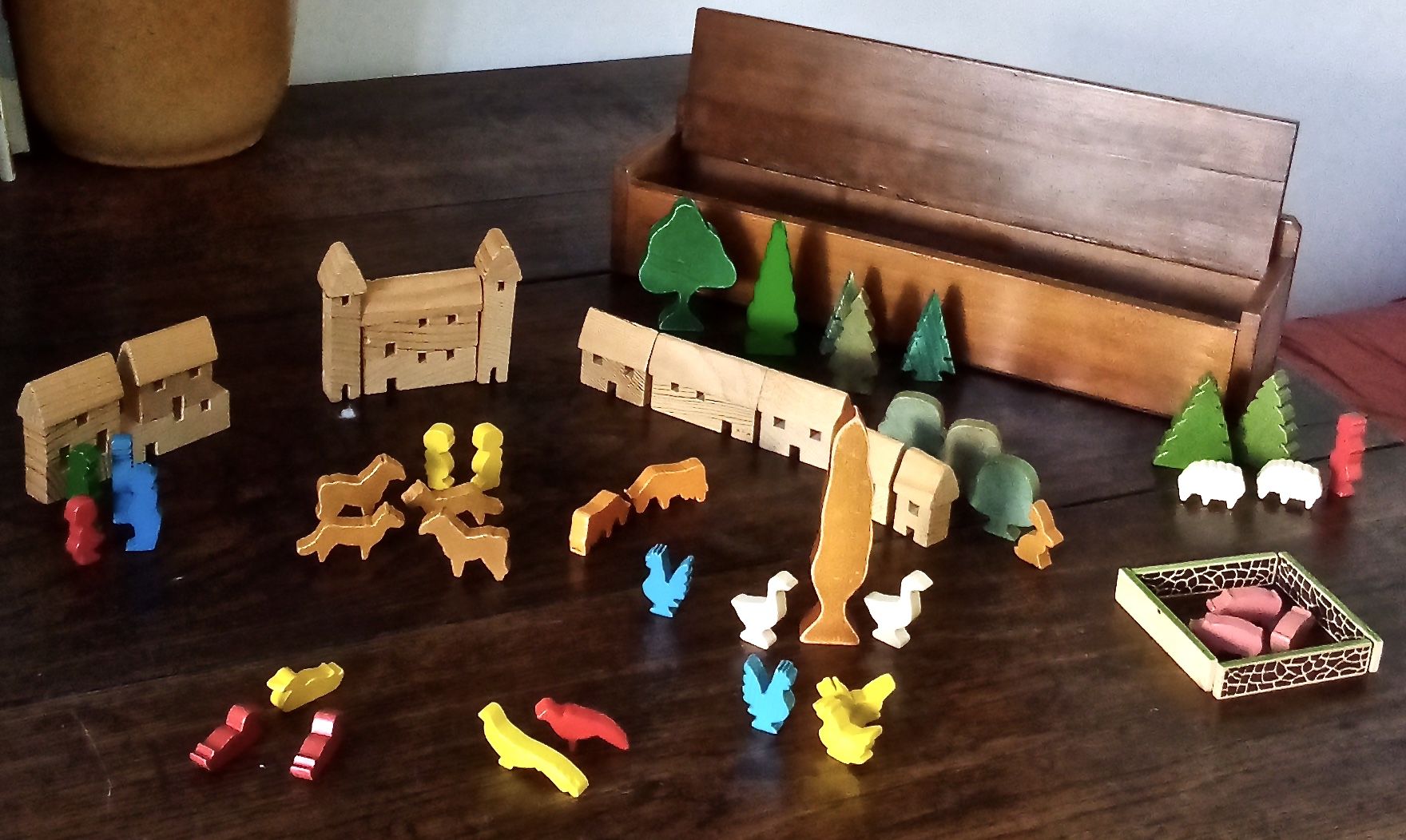 Village small farm wood painted with animals and characters stored in a large old box.