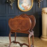Magazine Rack Called “Goat” From the End of the 19th Century in Wood and Canework in the Louis XV Style