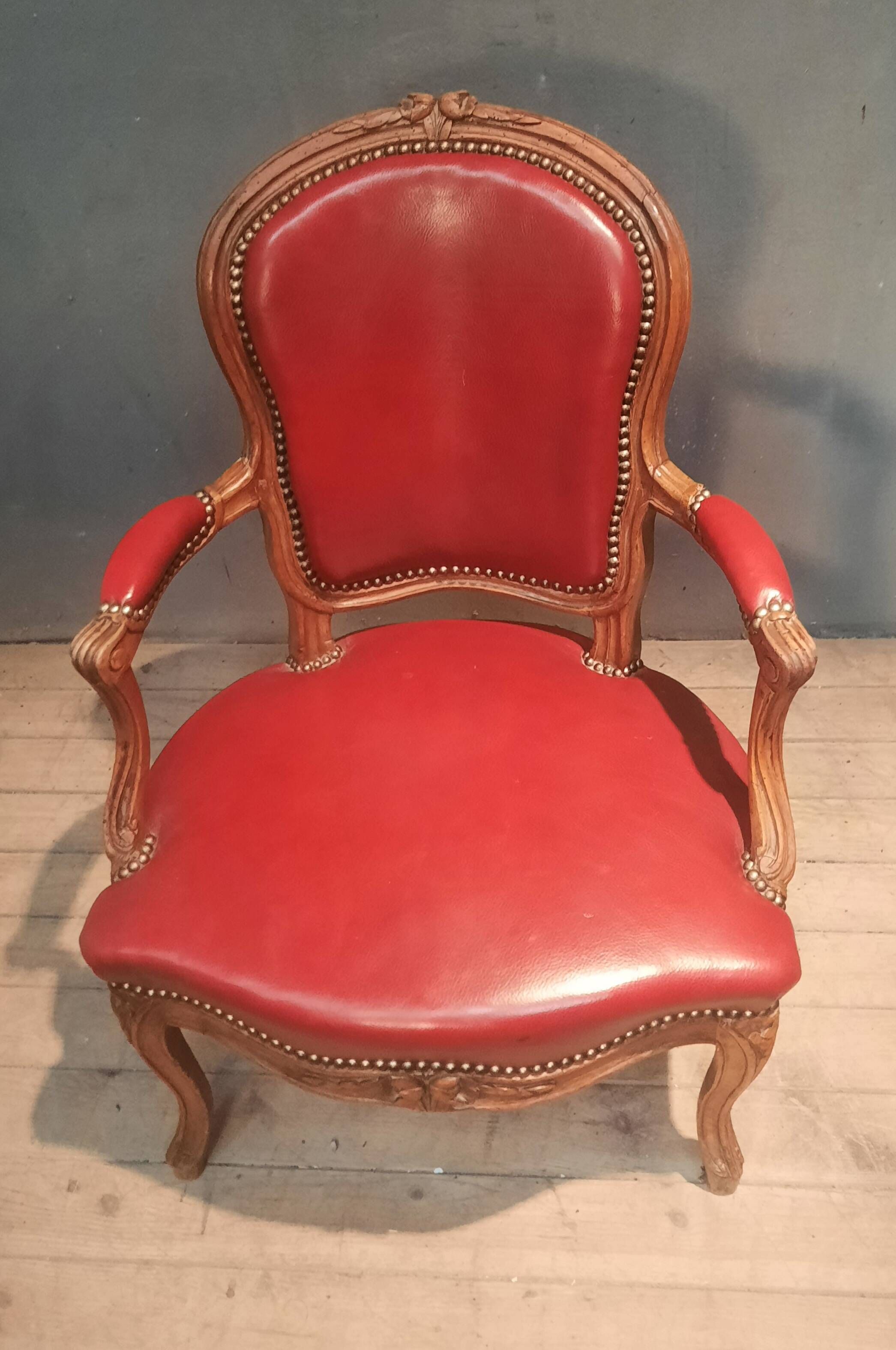Louis XV period armchair covered in leather.