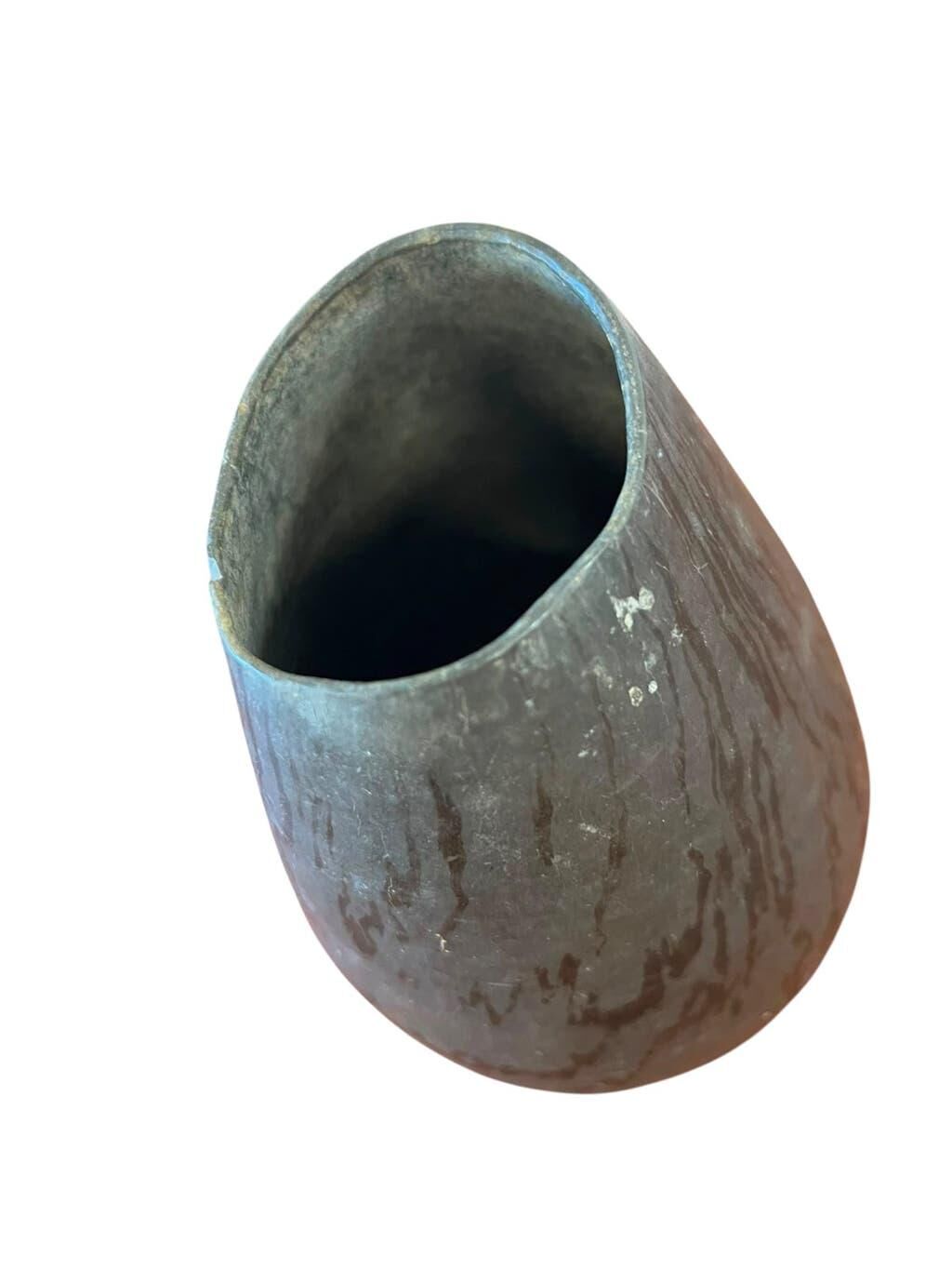 Vintage stone vase with worked fossil