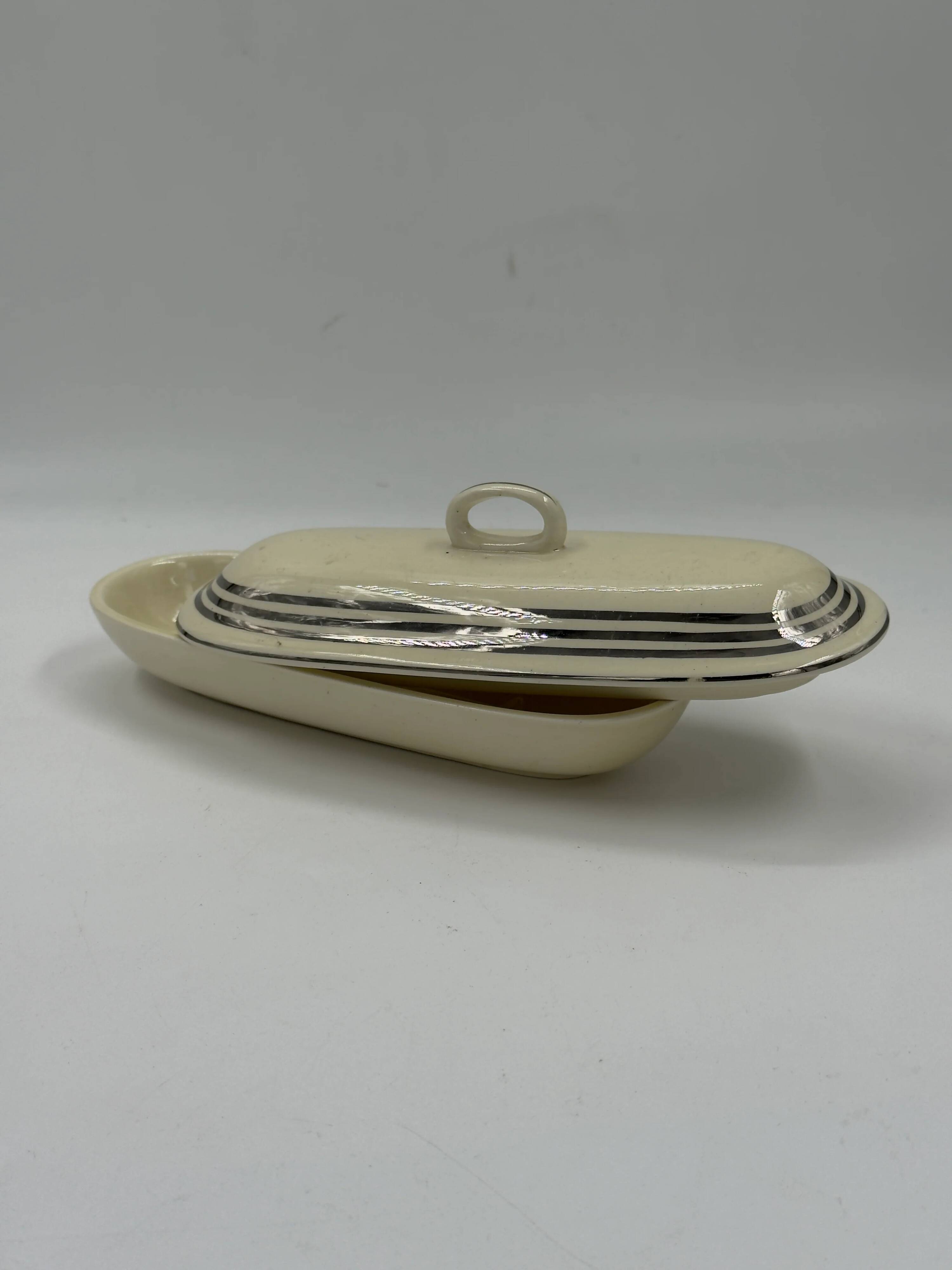 Vintage Art Deco butter dish in ivory ceramic with platinum stripes.