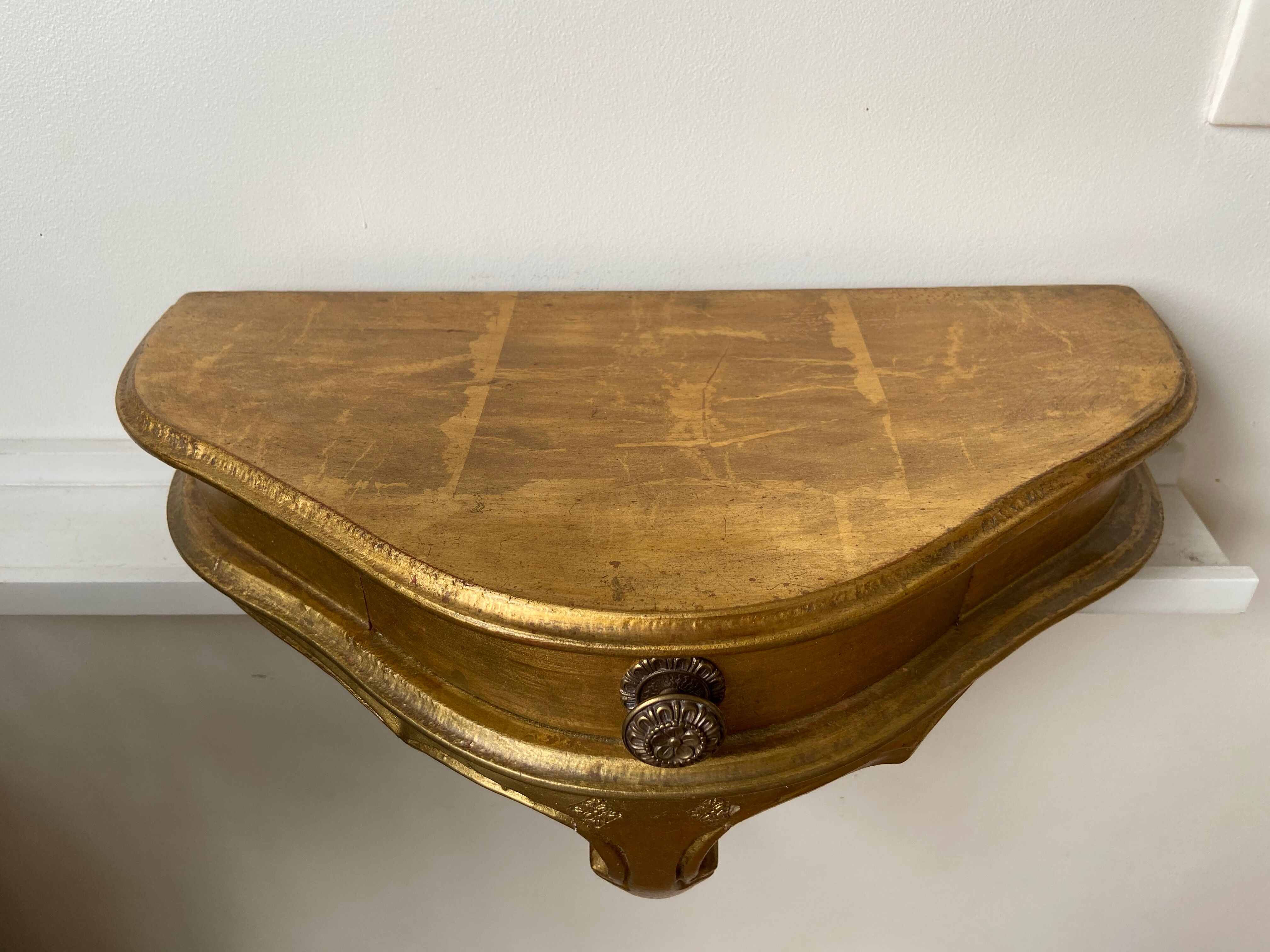 Gold wall shelf with drawer