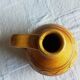 Round ochre glazed jug with handle