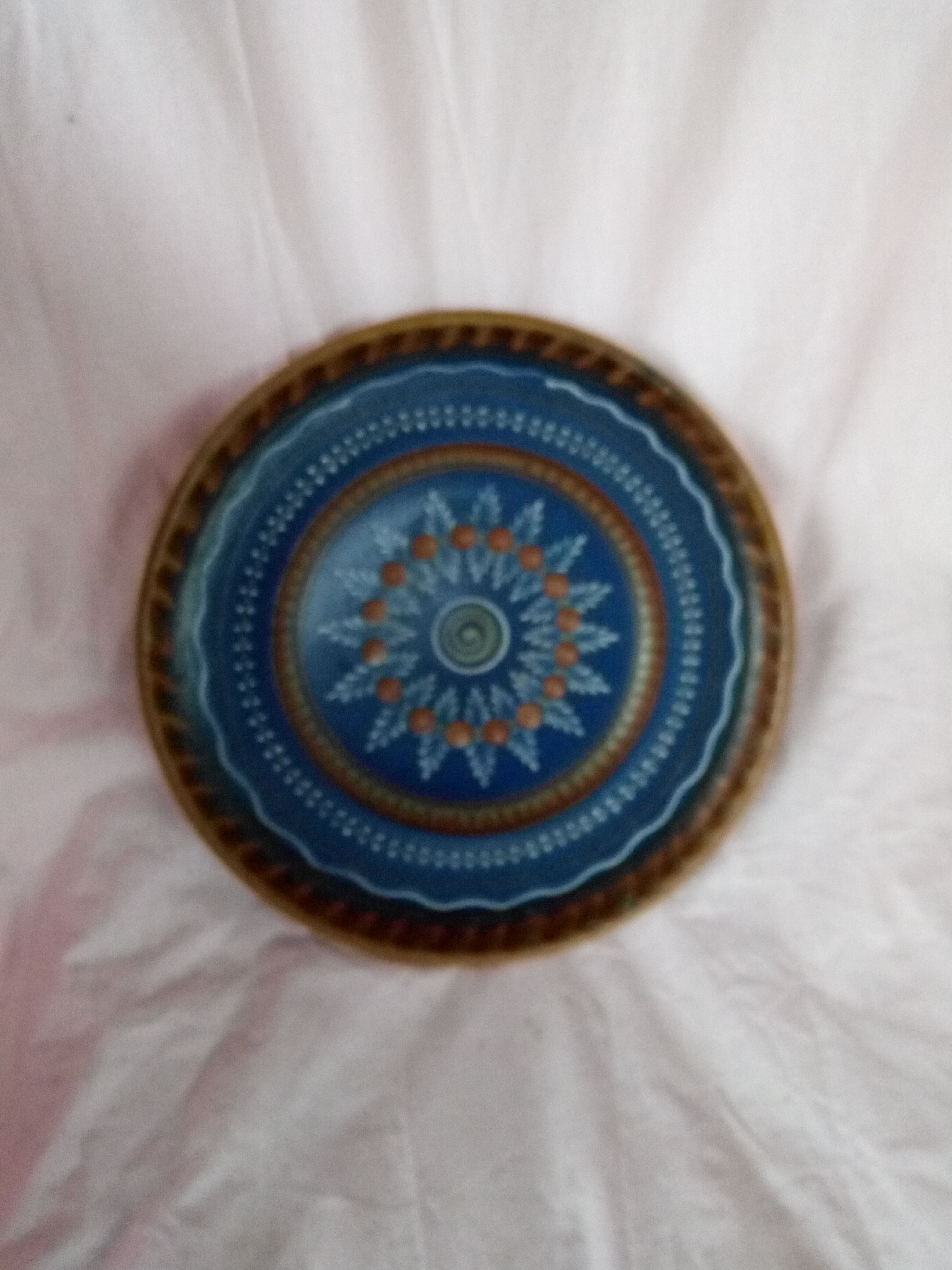 Plate in painted sandstone