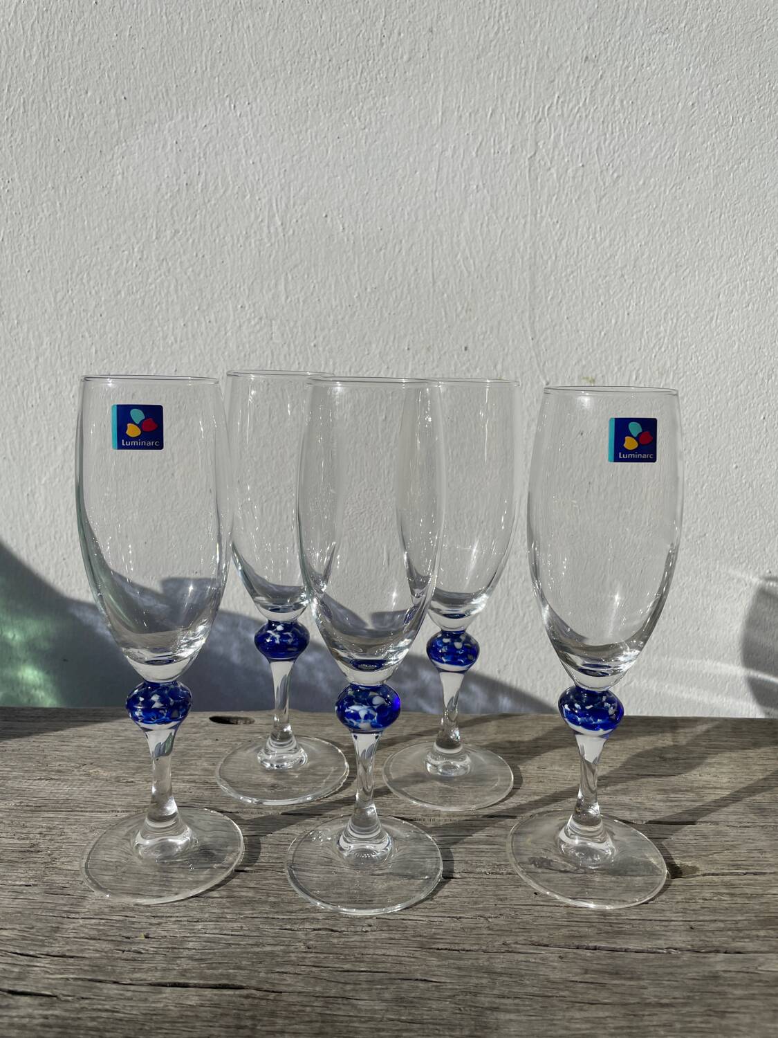 5 Luminarc blue glass flutes