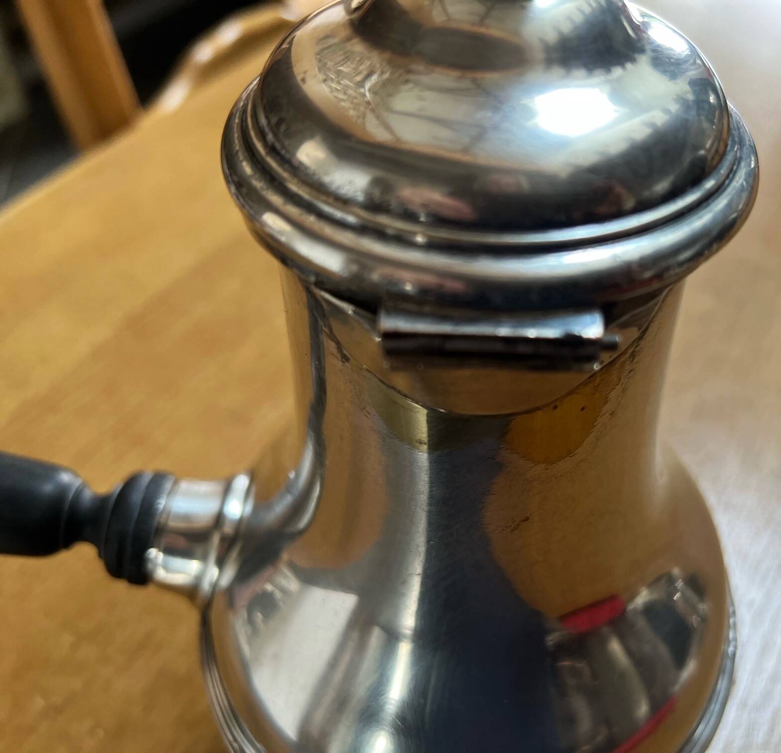 Silver-plated metal chocolate pot stamped ARGIT SFOA with an ebony handle.