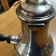 Silver-plated metal chocolate pot stamped ARGIT SFOA with an ebony handle.