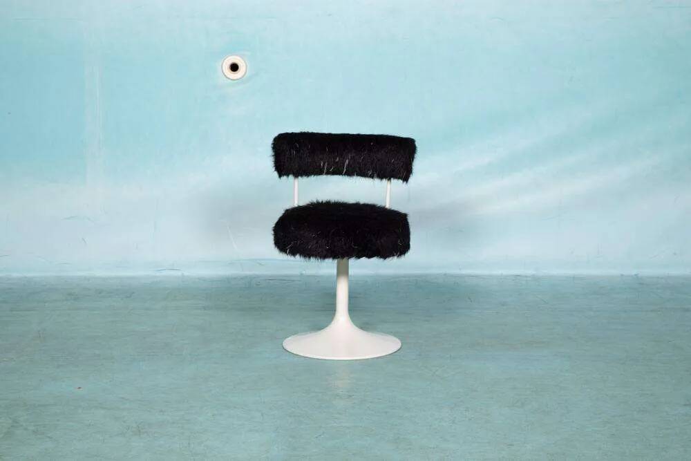Space age design armchair from the sixties, fluffy stool with trumpet base.
