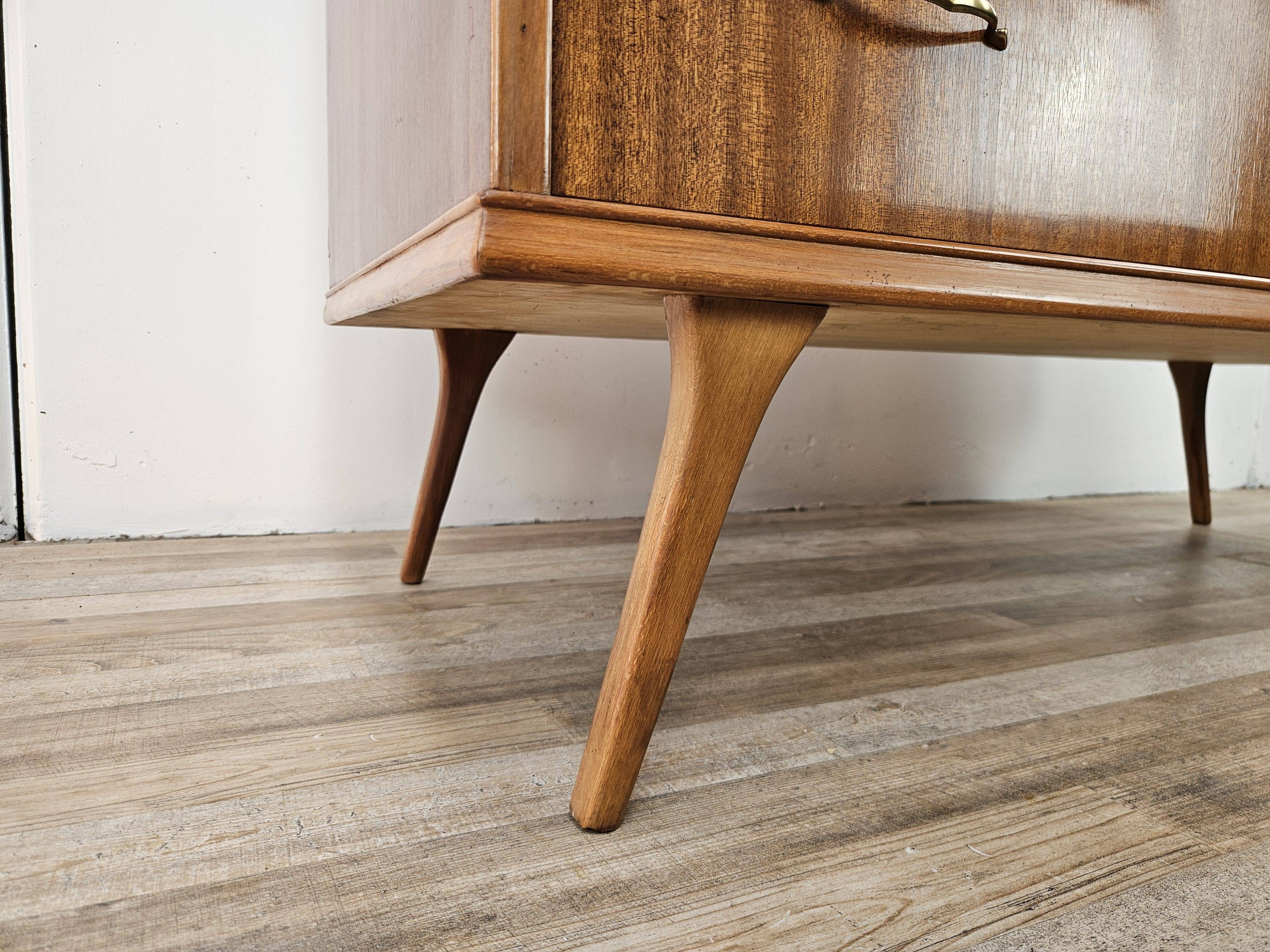 1950s chest of drawers covered in walnut with brass handles