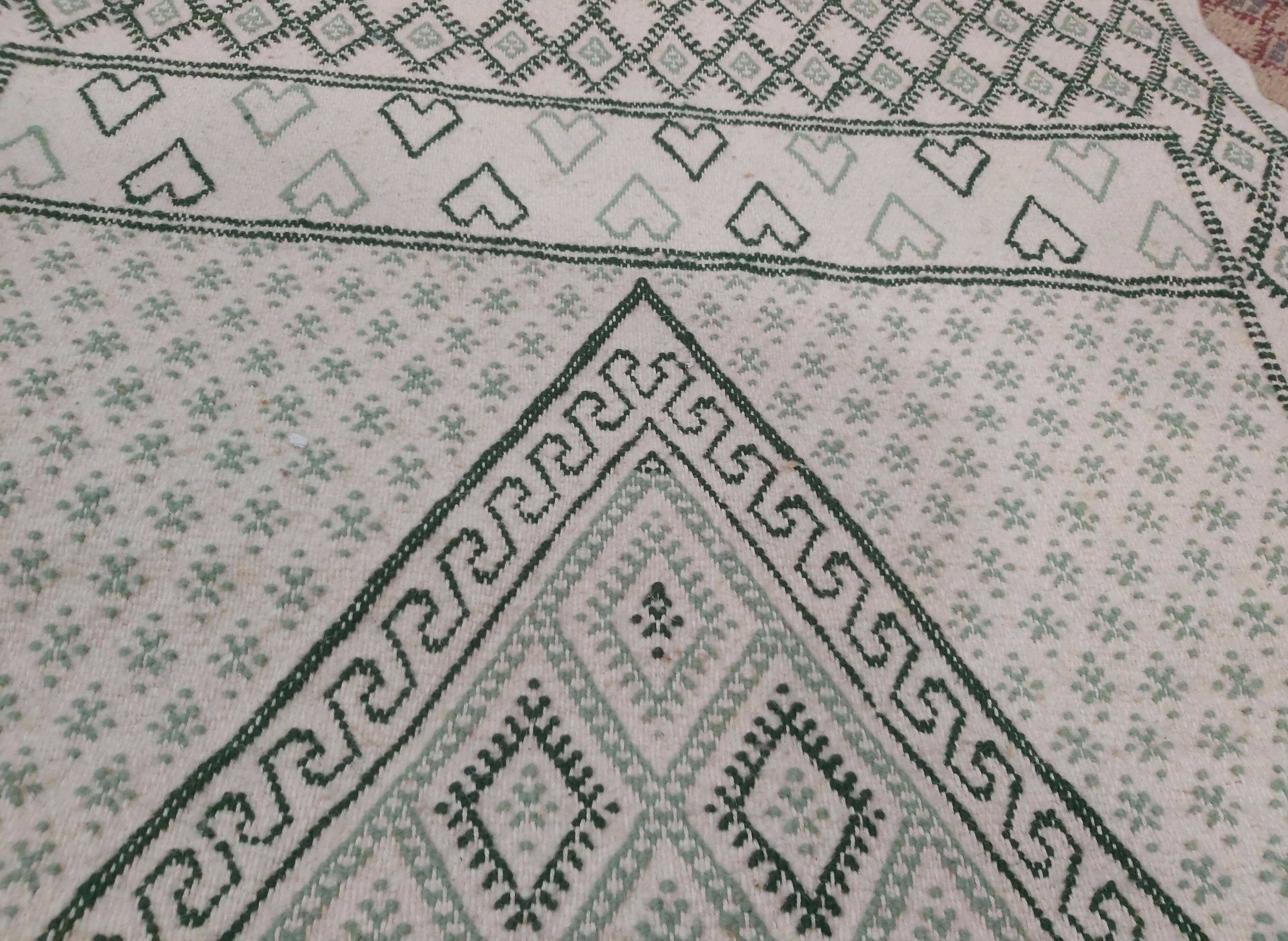 Traditional white and green carpet handmade in pure wool