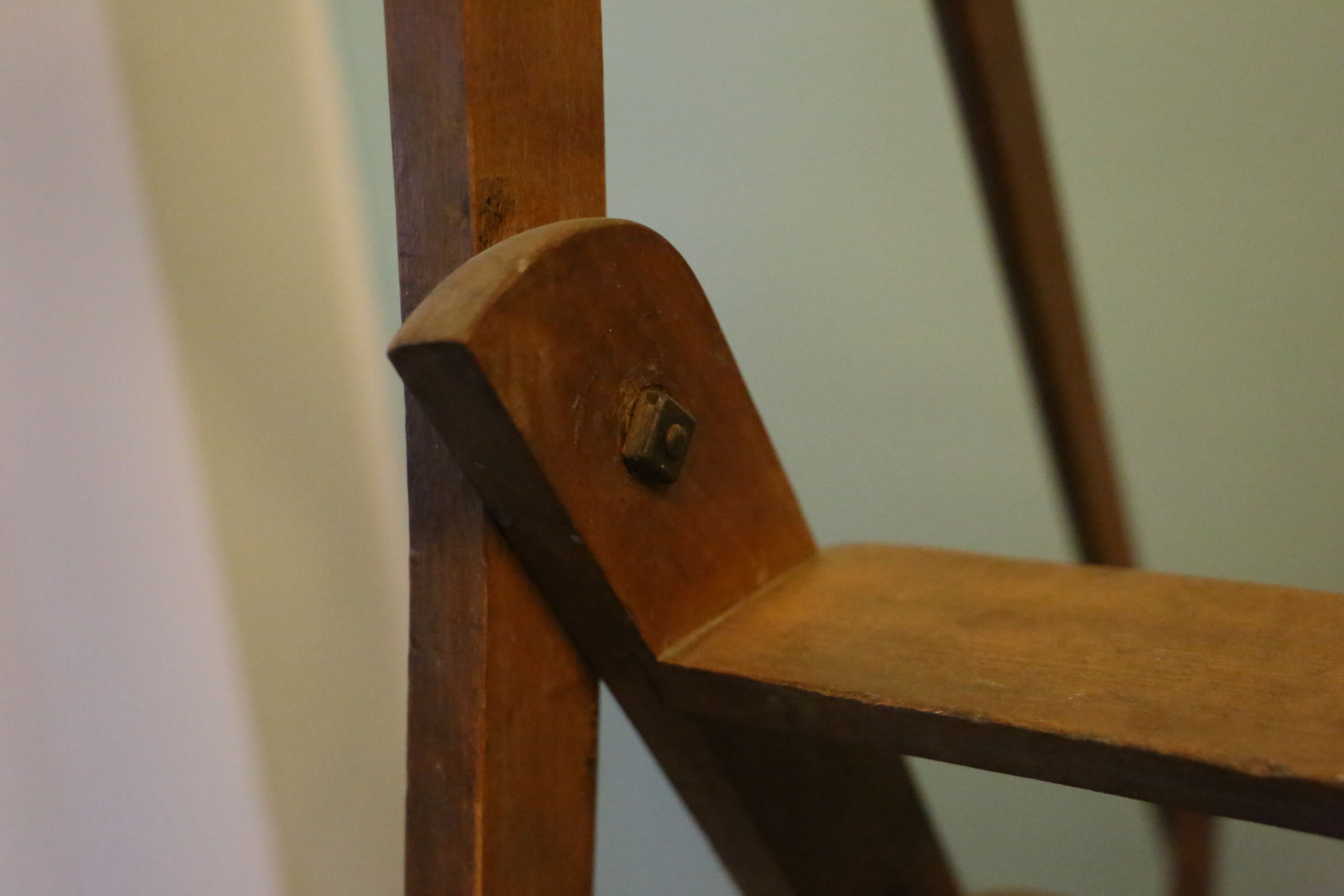 Old wooden stepladder with bodyguards