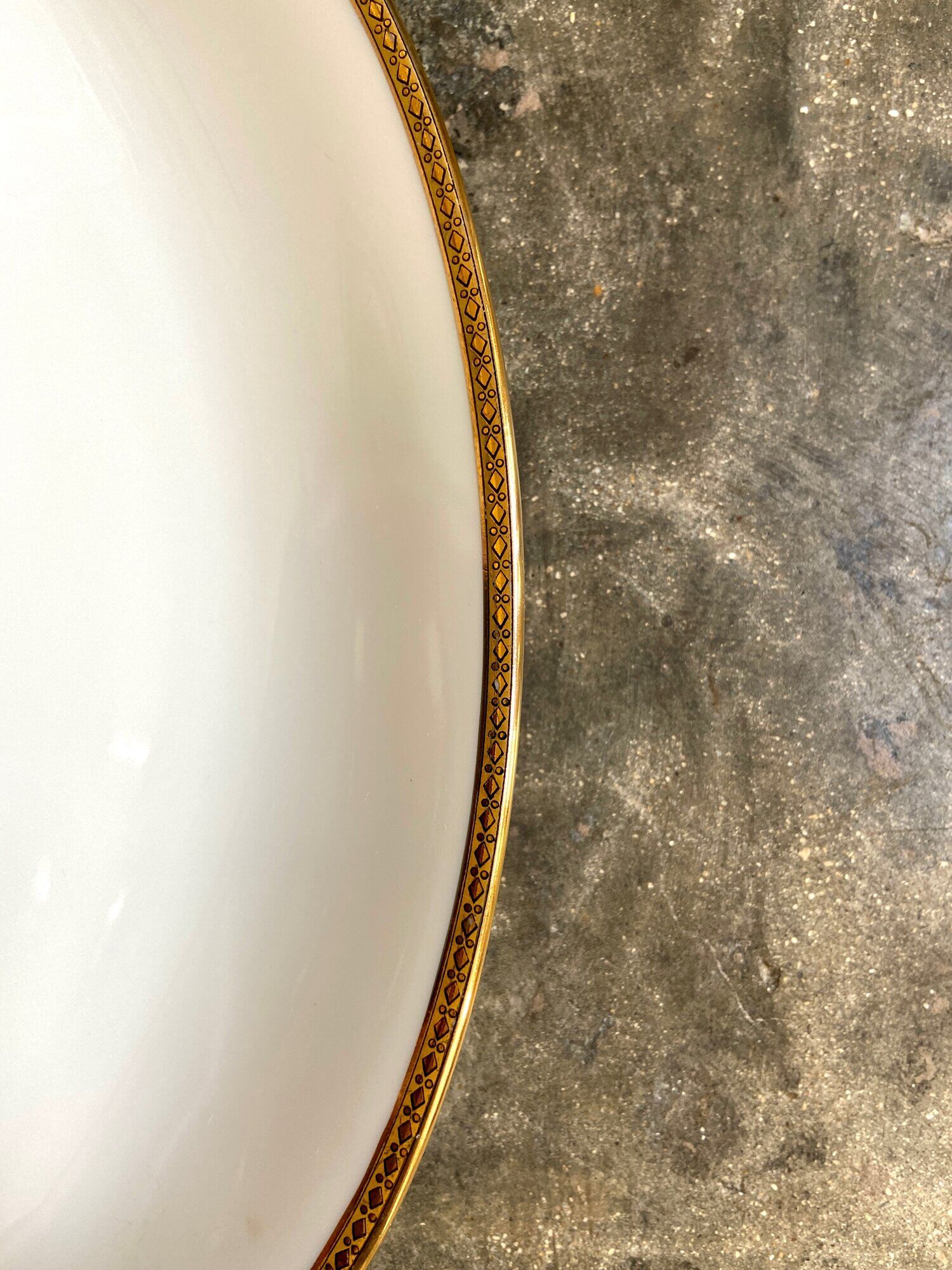 Oval dish in white and golden Limoges porcelain