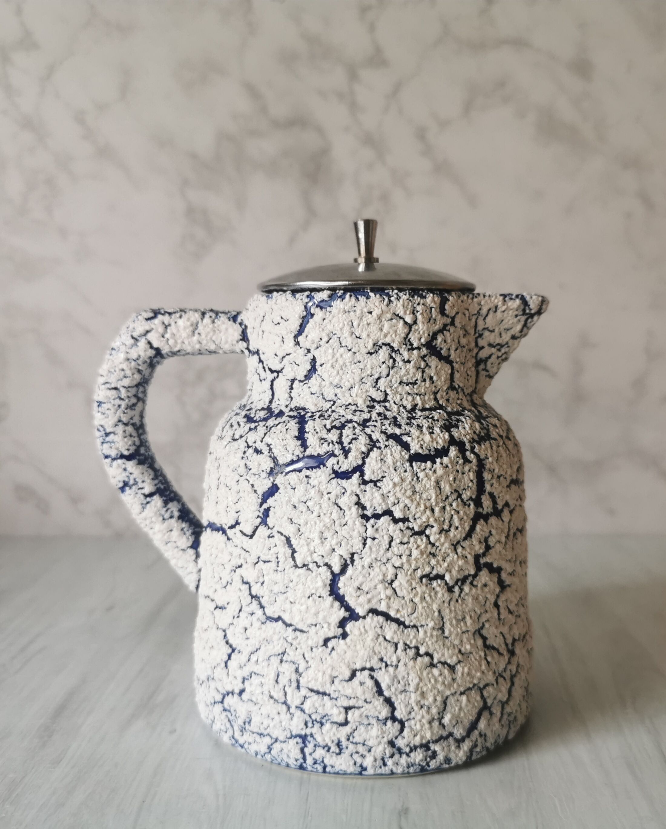 Cracked and enamelled ceramic teapot