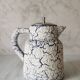 Cracked and enamelled ceramic teapot