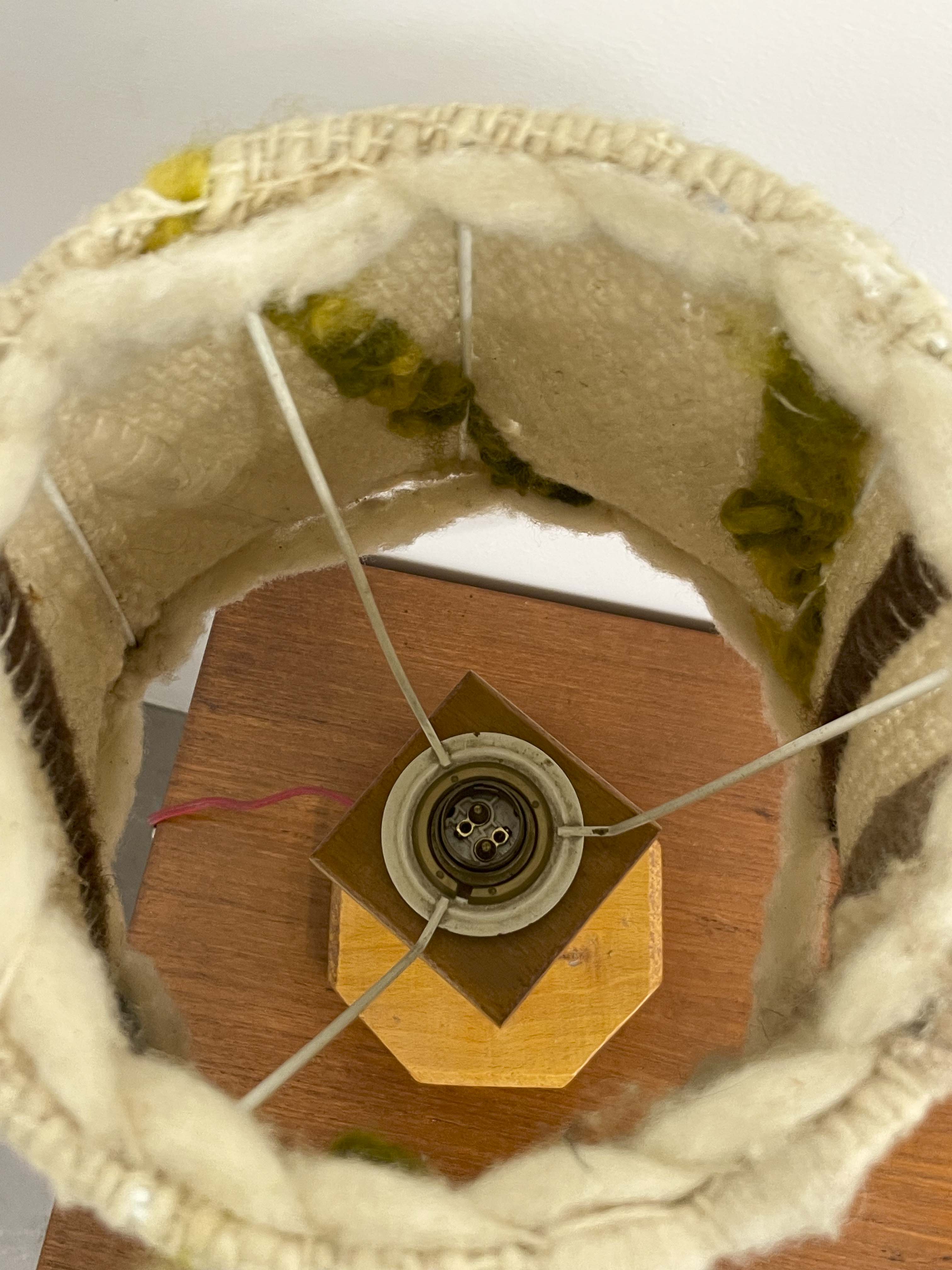 Wooden lamp with a wool shade