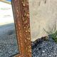 Antique mirror in patinated gilt wood