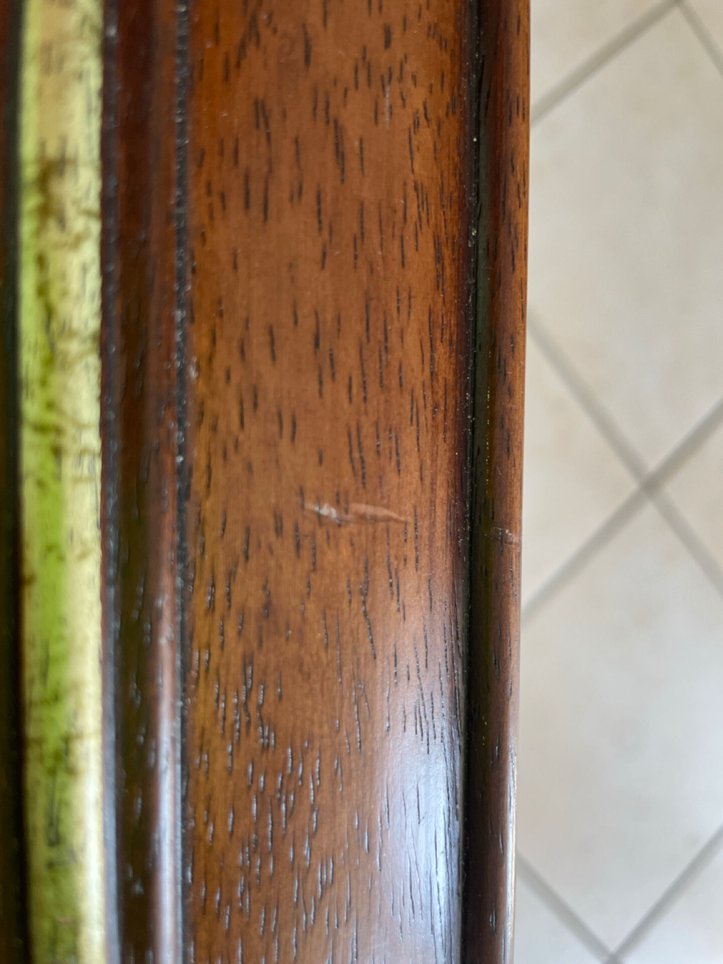 Vintage bevelled wall mirror in stained wood and brass