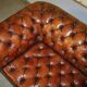 Pair of Early Victorian leather Chesterfield sofas by George Smith.