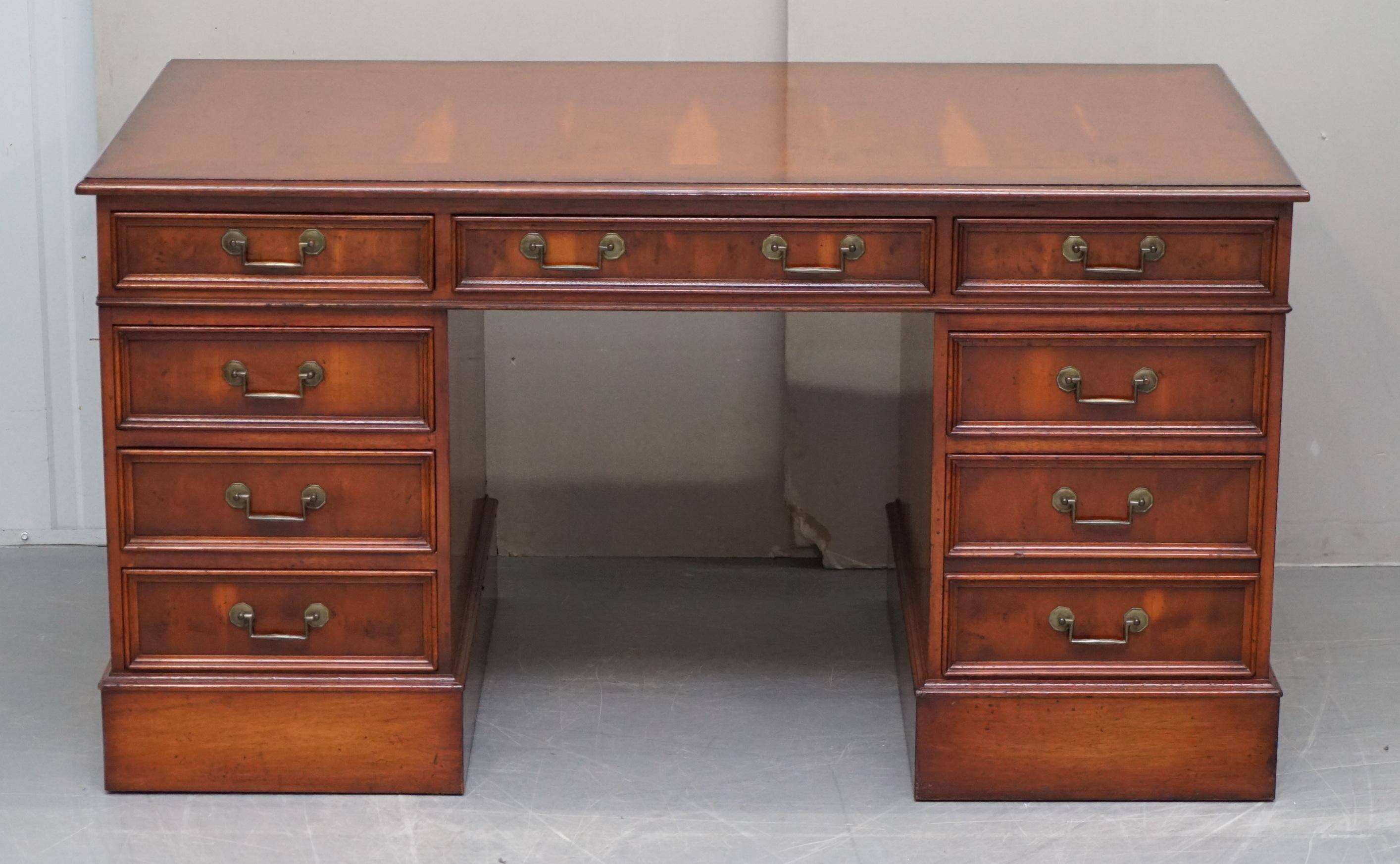Partner desk with double pedestal in burr yew wood with decorated top.