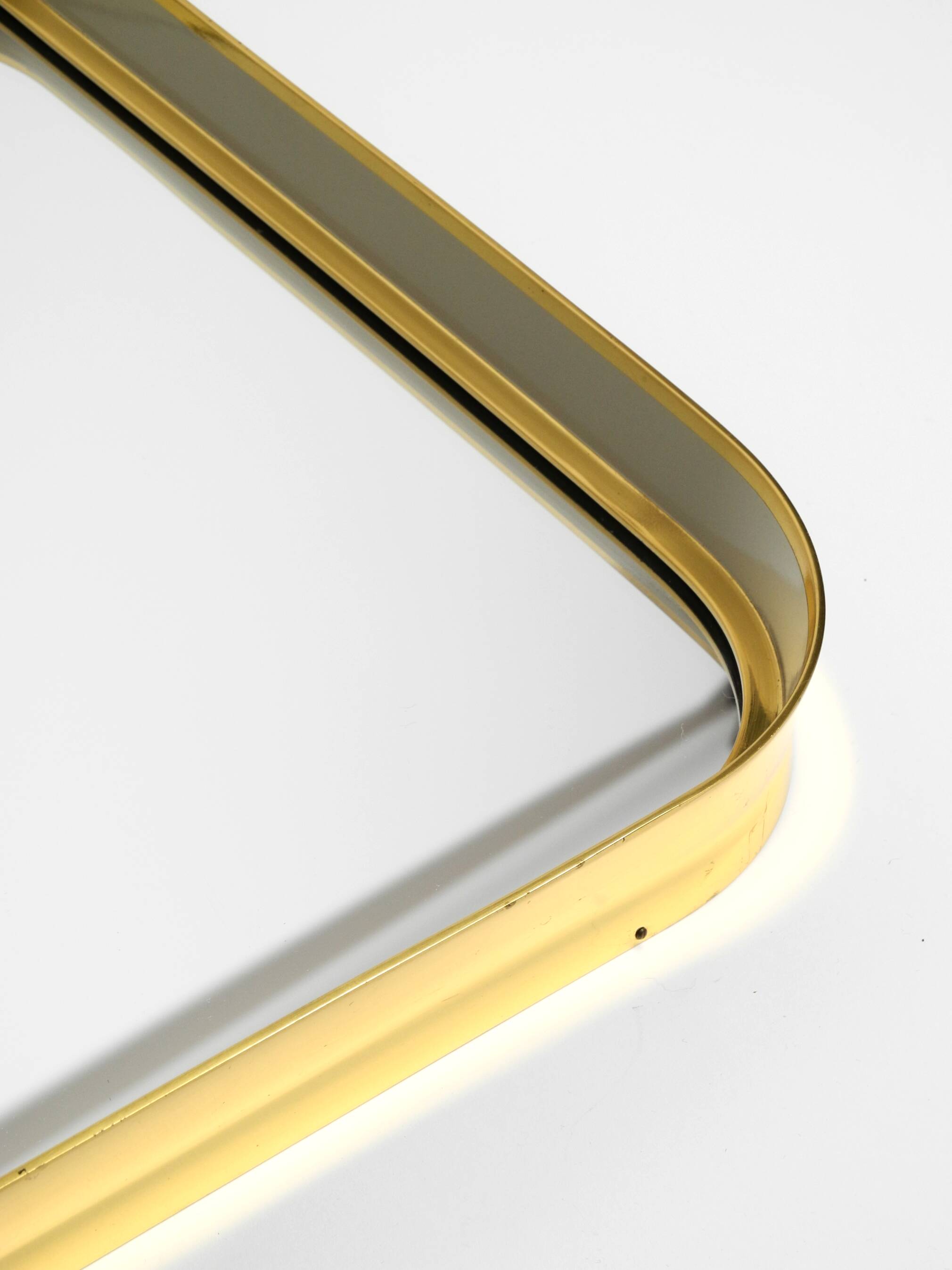 Beautiful original Mid Century Modern "Zier-Form" wall mirror with heavy br