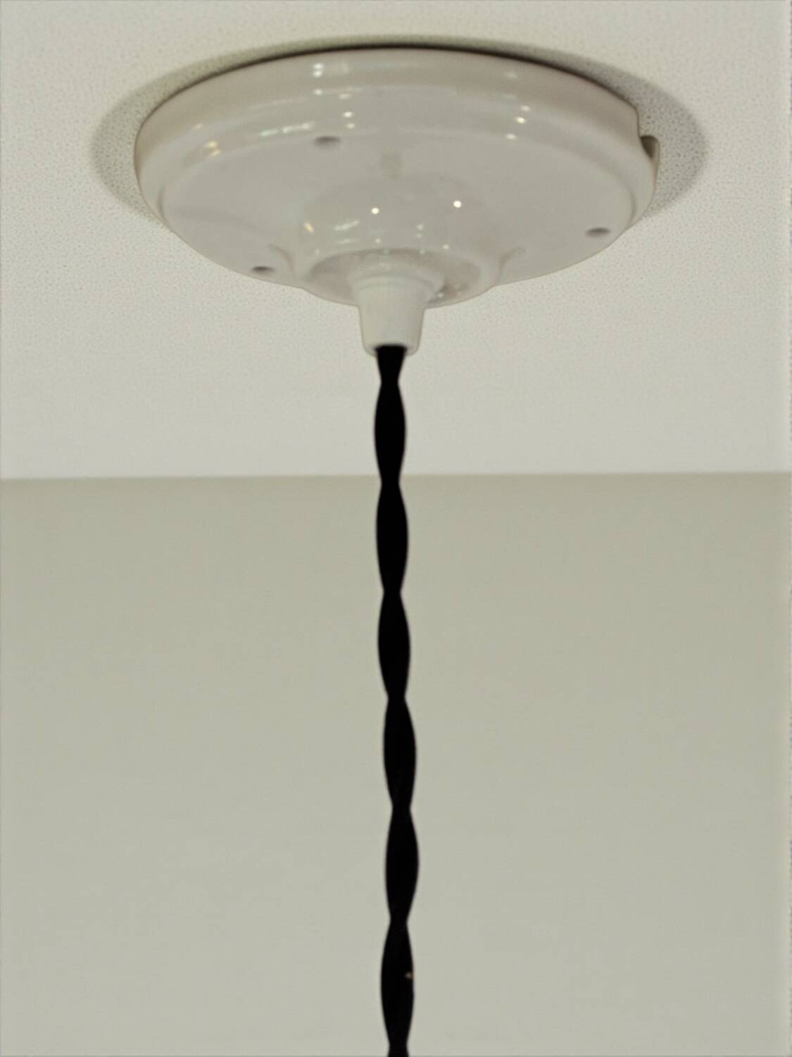 Industrial pendant light made of speckled enameled sheet metal and opaline