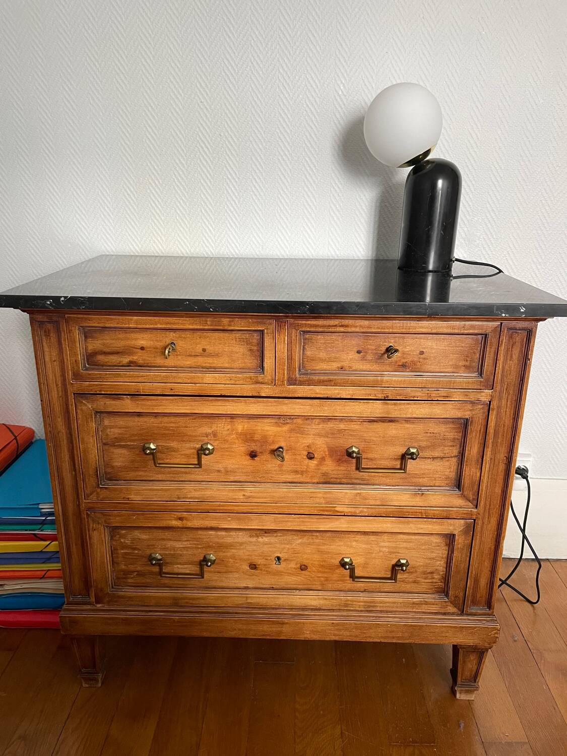 Antique wooden order with black marble top