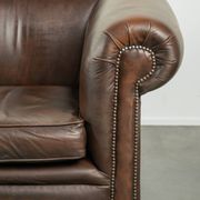 Set of a smooth chesterfield sofa and armchair with a timeless English look