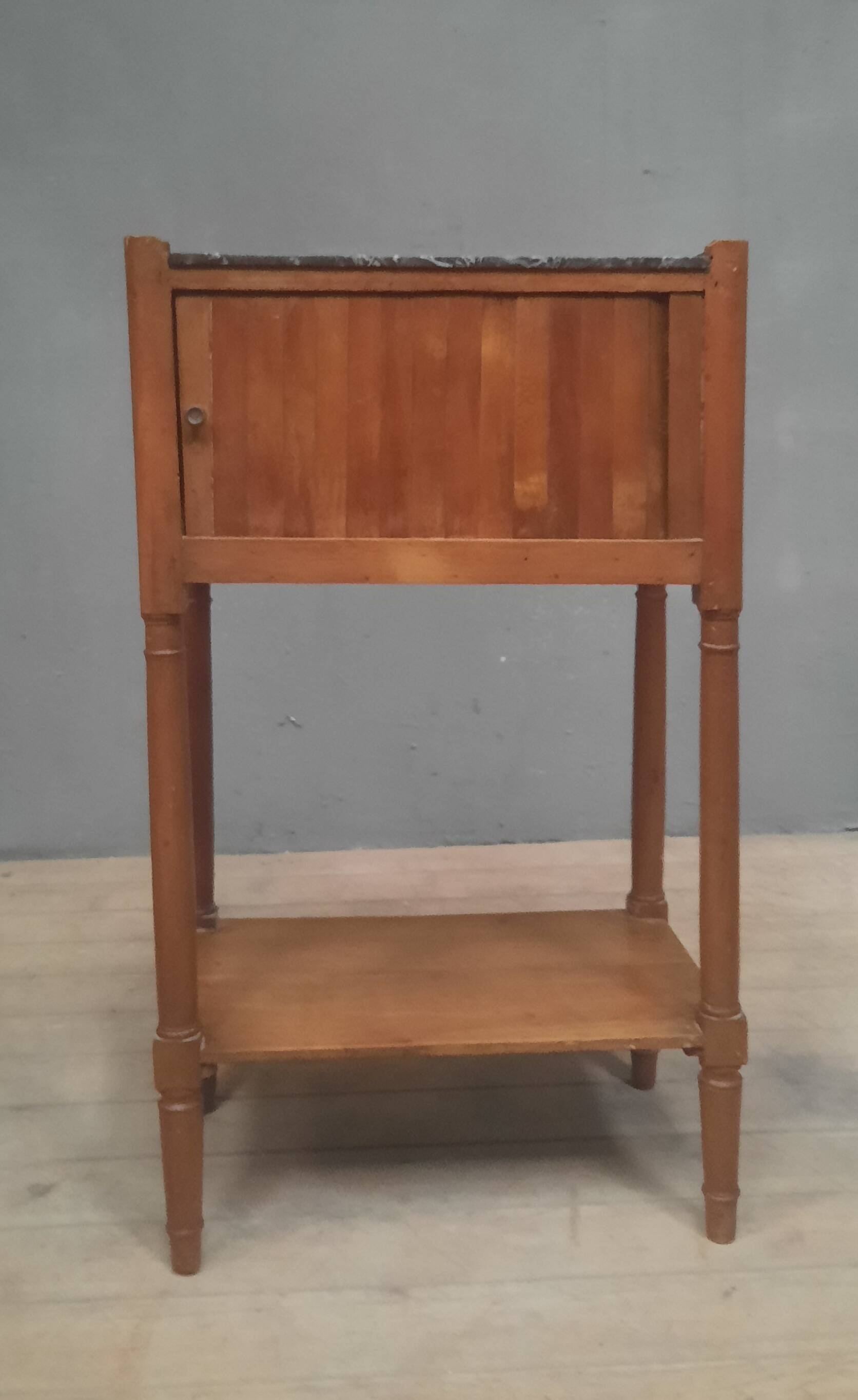 Curtained bedside table from the nineteenth century.