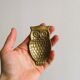 Gold metal owl pocket emptier
