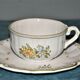 Two MOUSTIER cups decorated with flowers signed