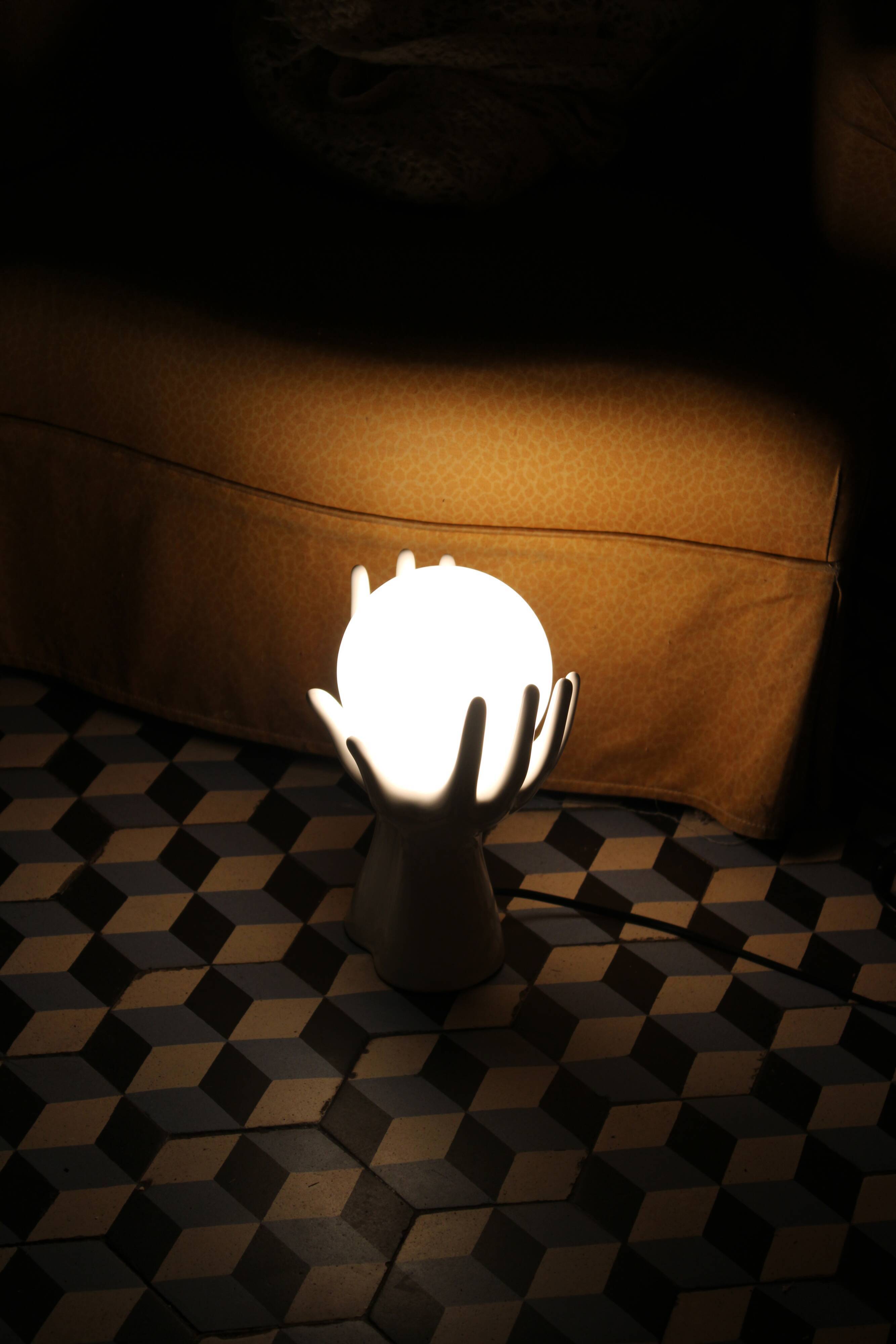 Hand-shaped lamp and opaline globe