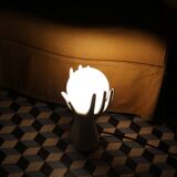Hand-shaped lamp and opaline globe