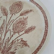 A pair of vintage plates with a rust-brown thistle design – 1950s.