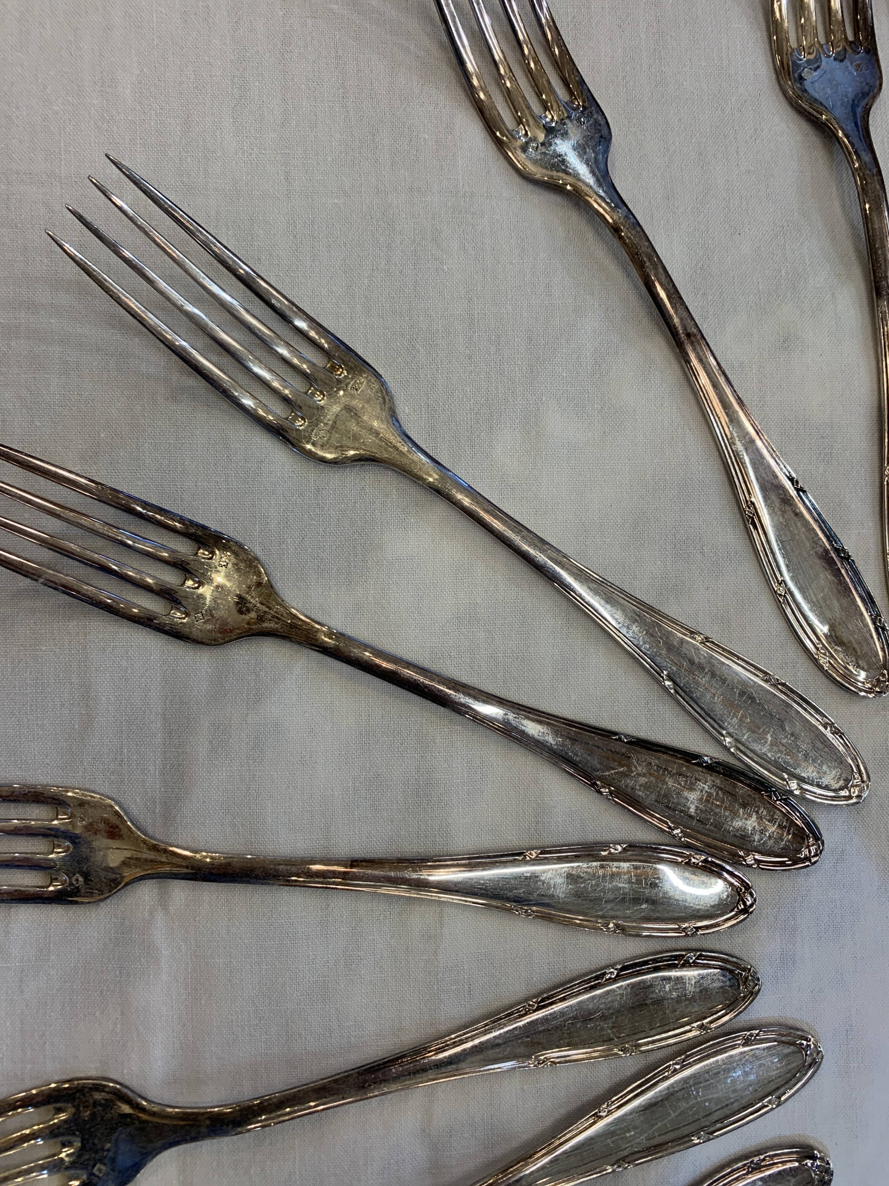 Series of 12 forks and 12 silver metal spoons