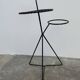 Black metal tripod plant holder