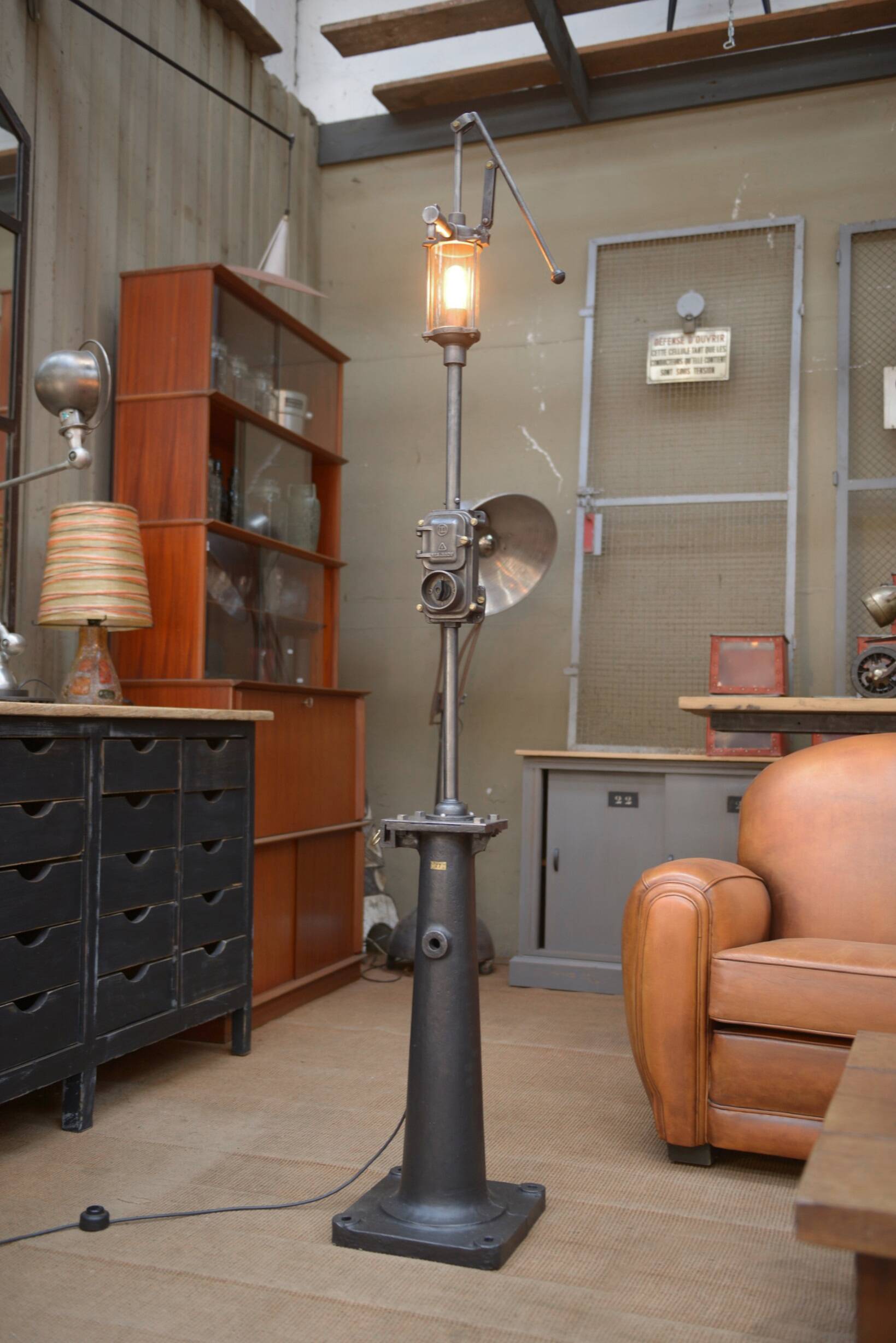 Old gas pump floor lamp in cast iron metal and glass 1930