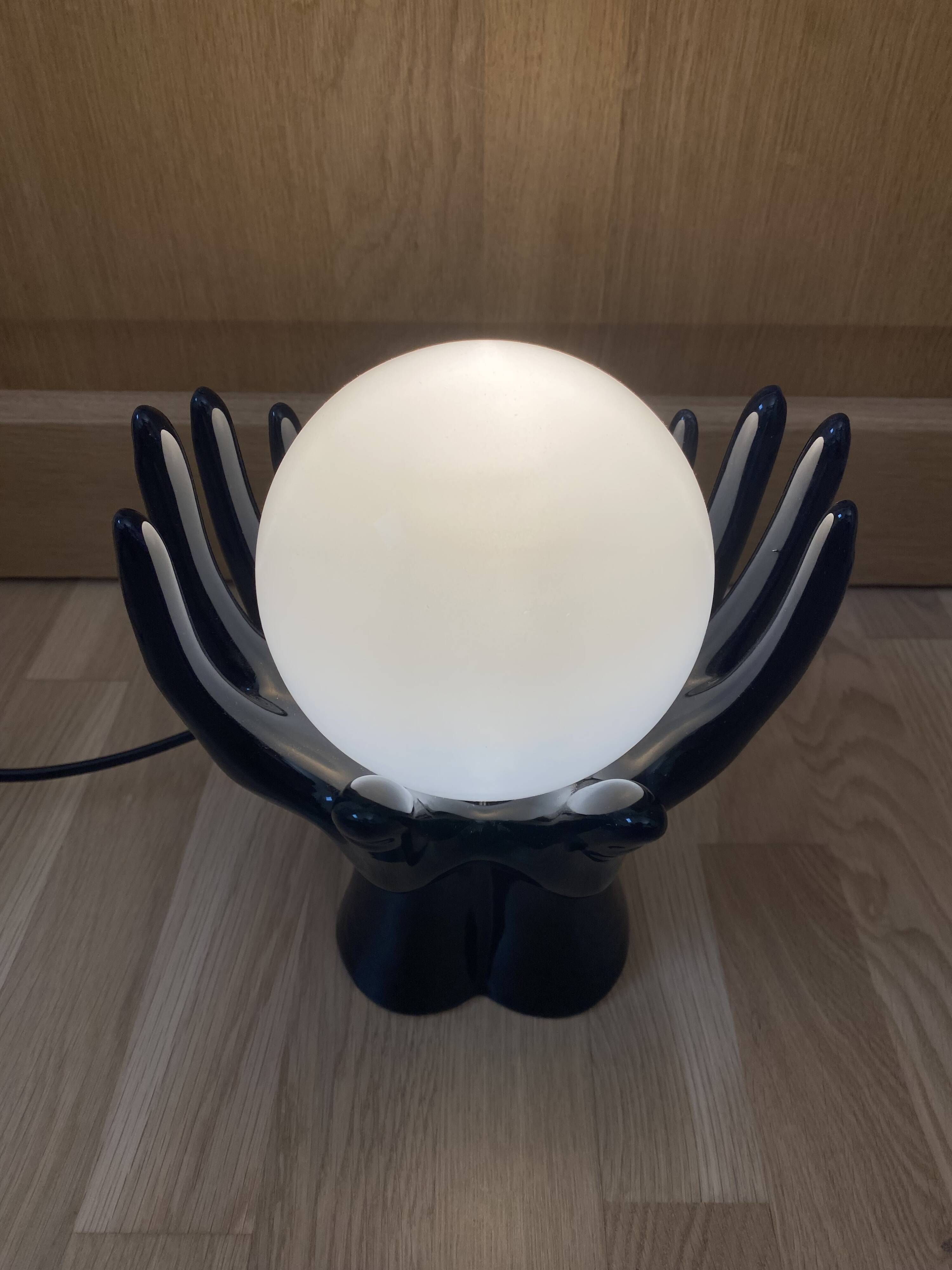 Sculpted ceramic globe lamp.