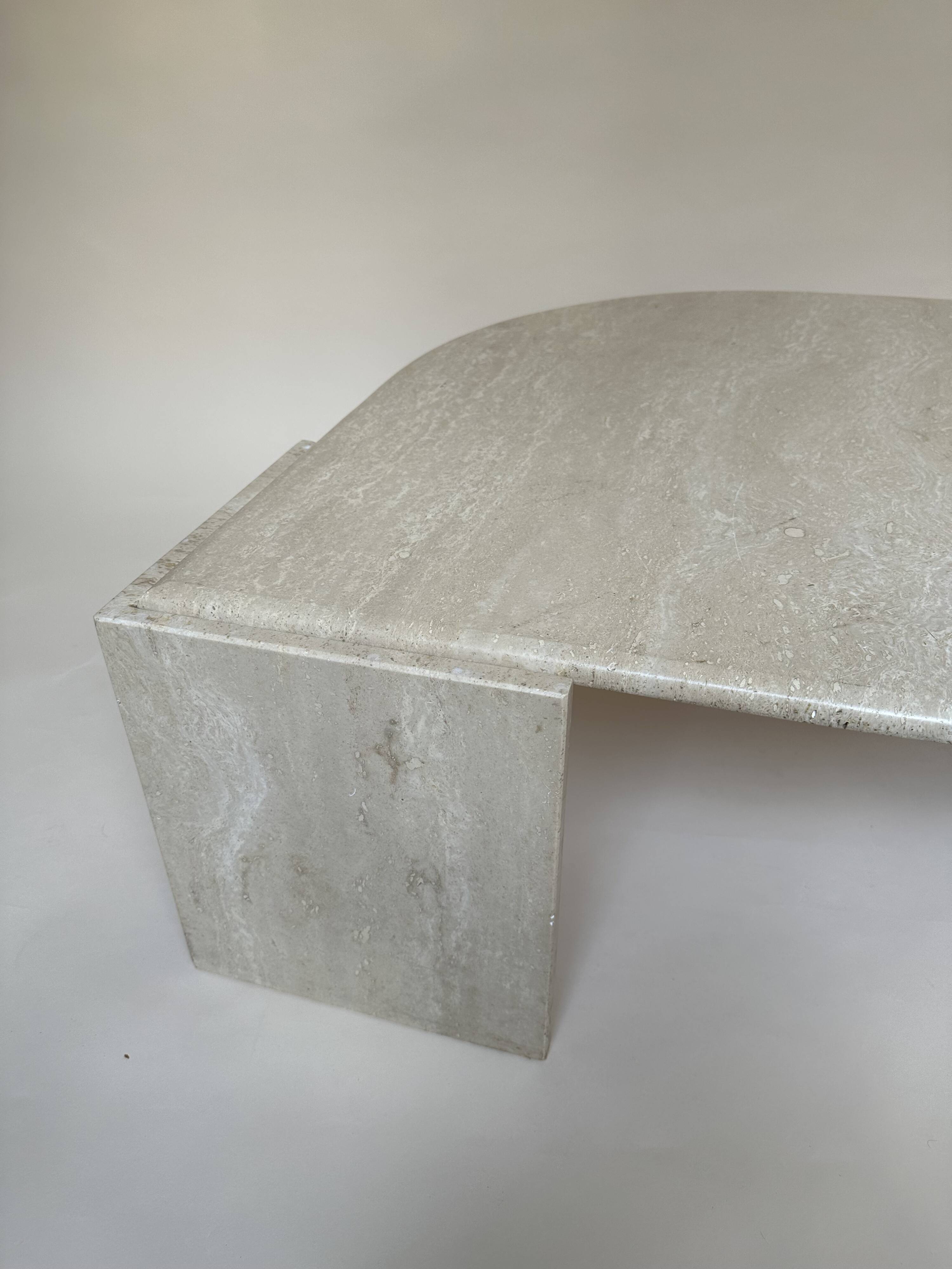 Travertine eye-shaped coffee table
