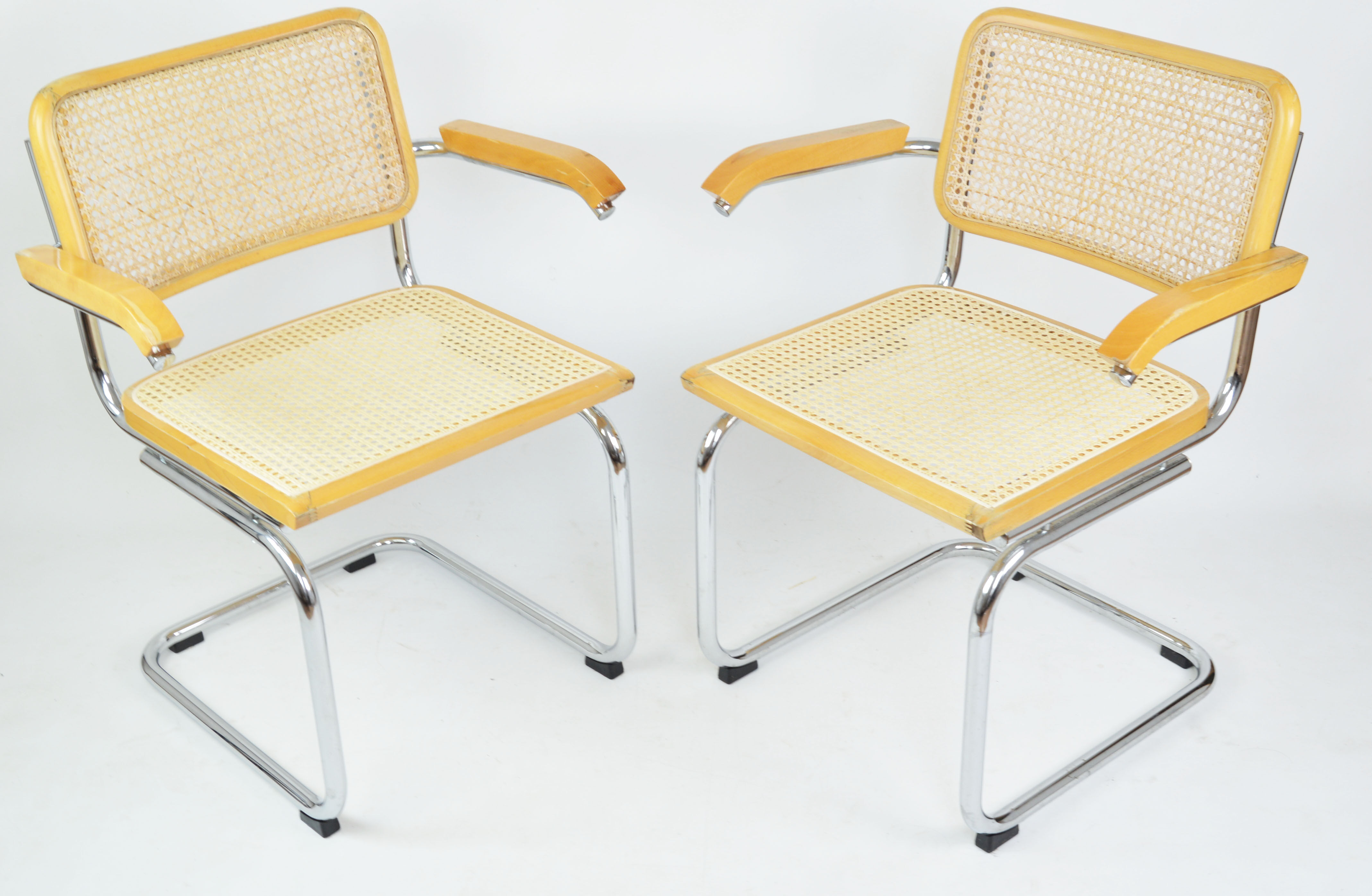 A pair of chairs with armrests, 1970s