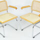 A pair of chairs with armrests, 1970s