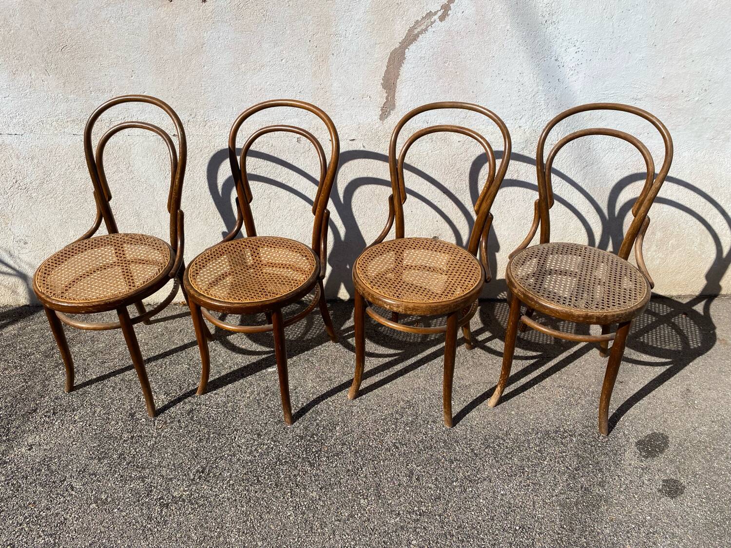 Set of 4 wooden and cane bistro chairs